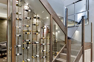 Staircase complete with Glass Wine Cellar