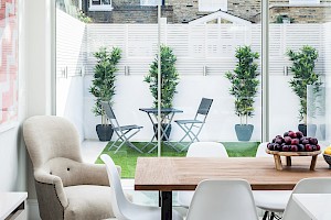 Informal dining area with view of the outside Patio part of a basement conversion Fulham, London.